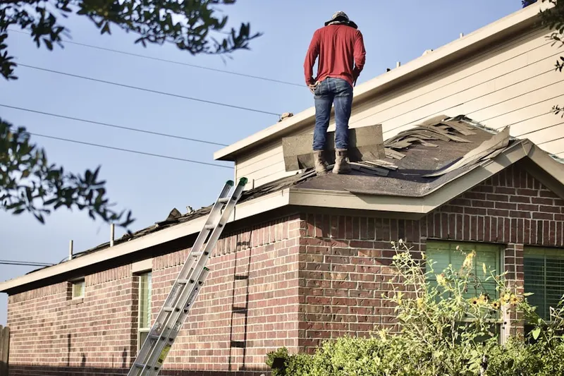 Professional roofer working on a residential roof in Rancho Mirage